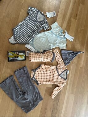 NWT Baby Clothes lot includes mix and match onesies, pant, hat, socks and blanke